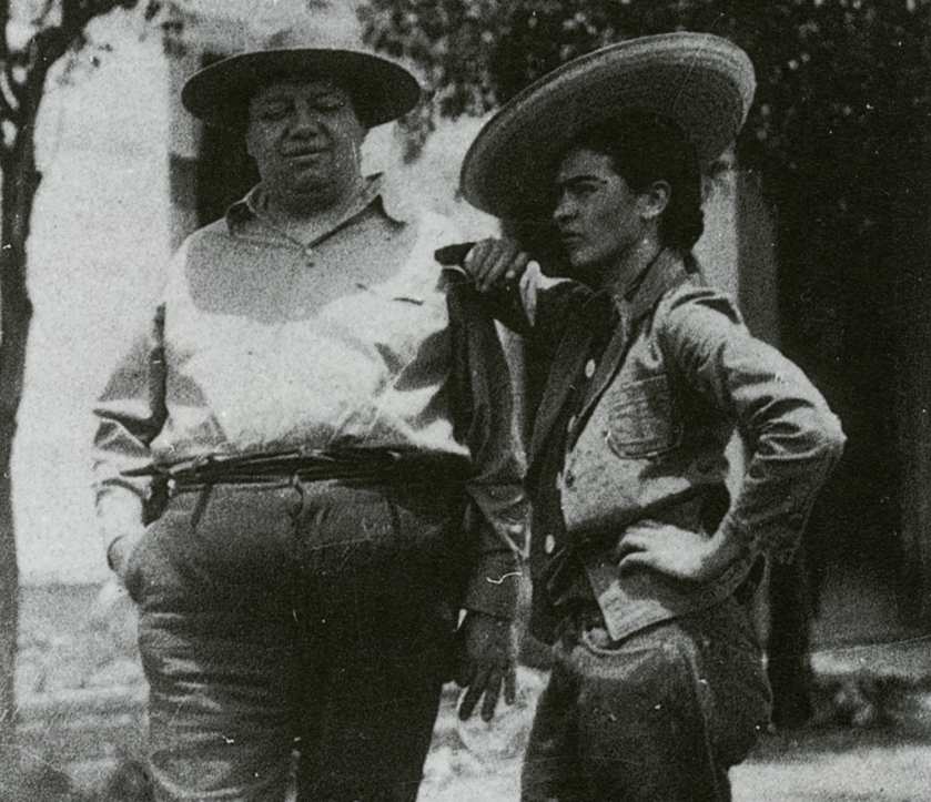 black and white photograph of Frida Kahlo wearing a sombrero with Diego Rivera