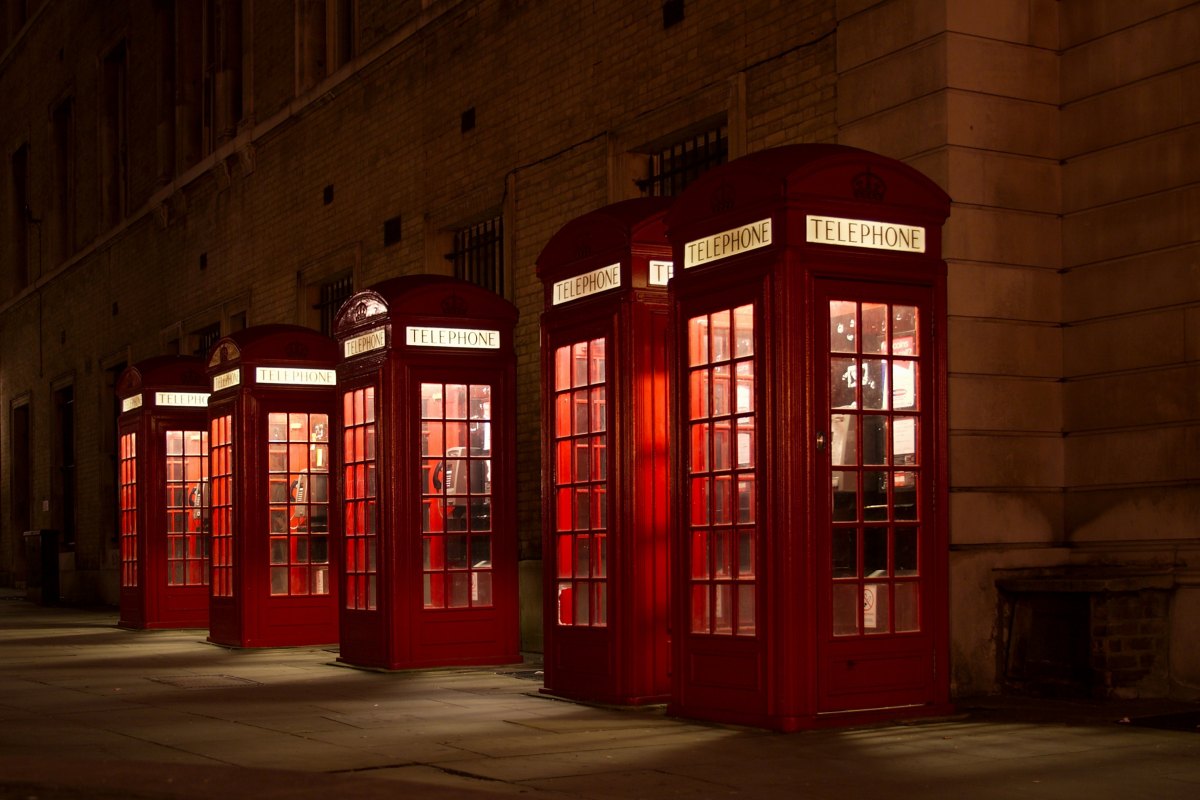 red telephone boxes in London at night